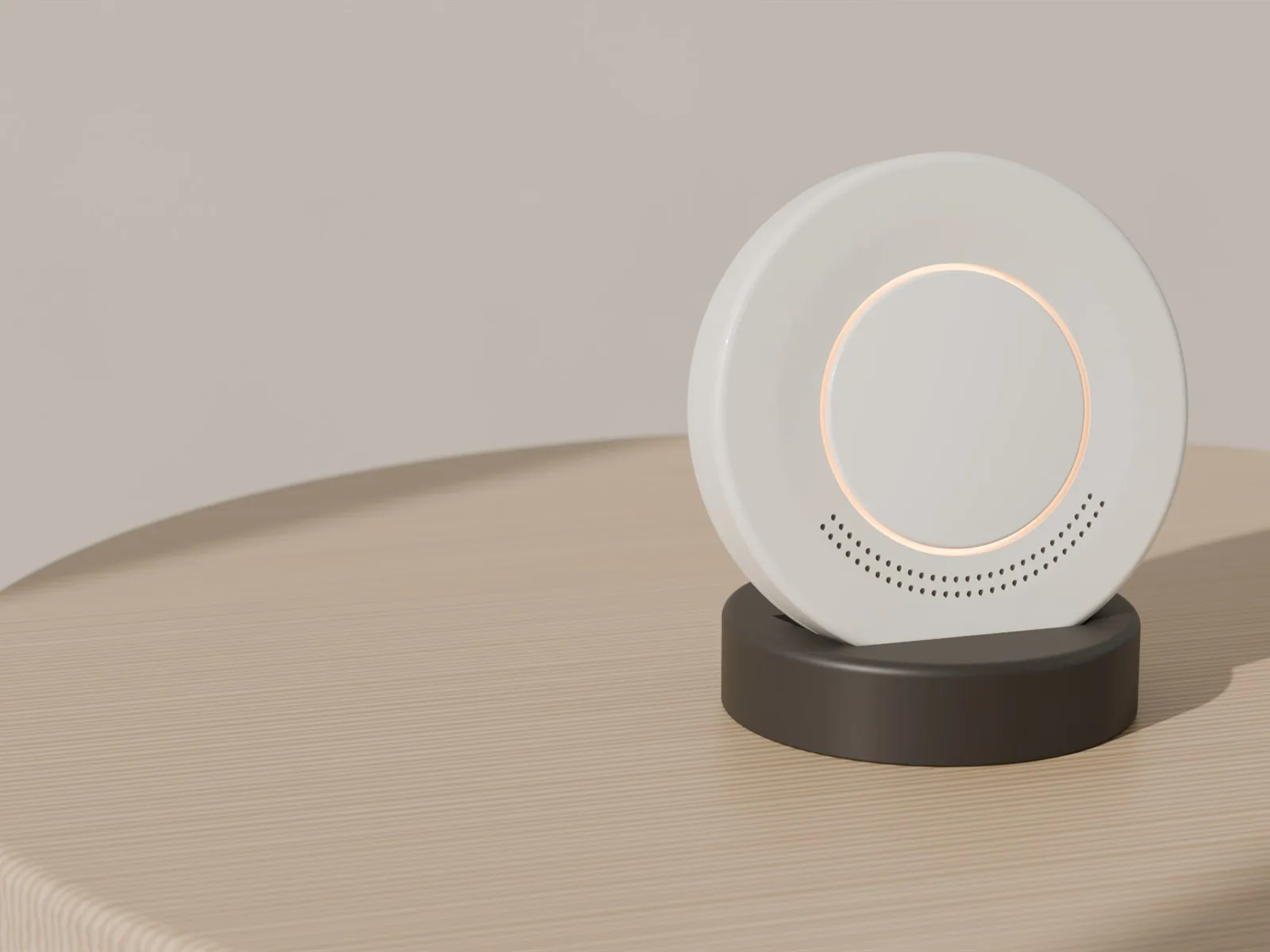 The TEND hub with its soft light ring, on a wooden table.